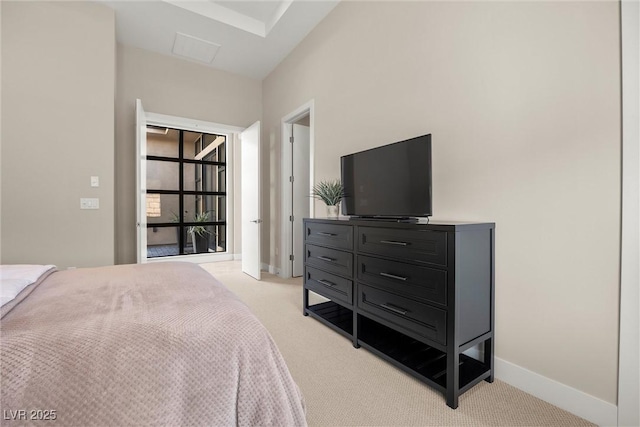 bedroom featuring light carpet