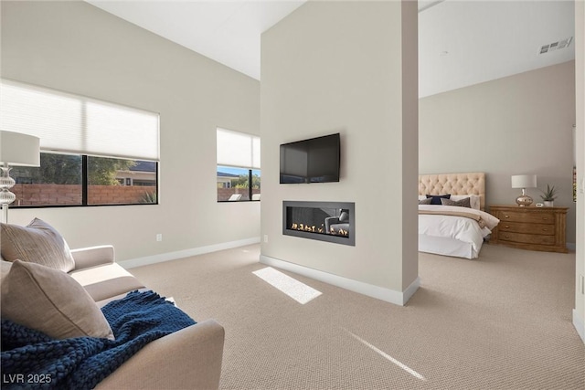 carpeted living room featuring vaulted ceiling