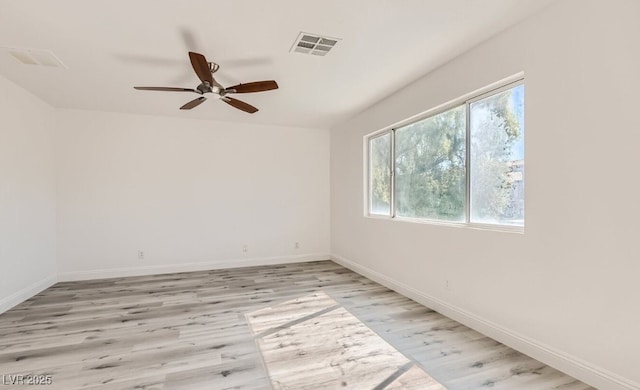 spare room featuring ceiling fan and light wood-type flooring