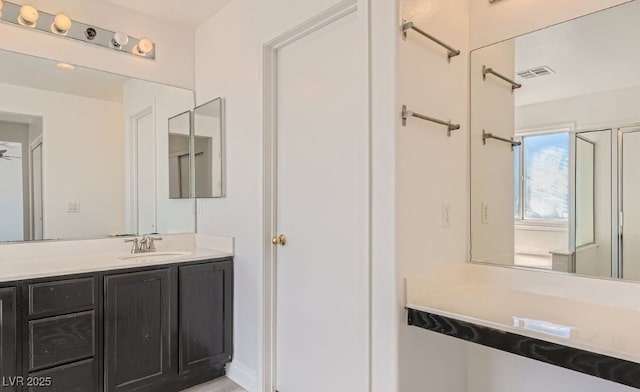 bathroom featuring vanity and ceiling fan