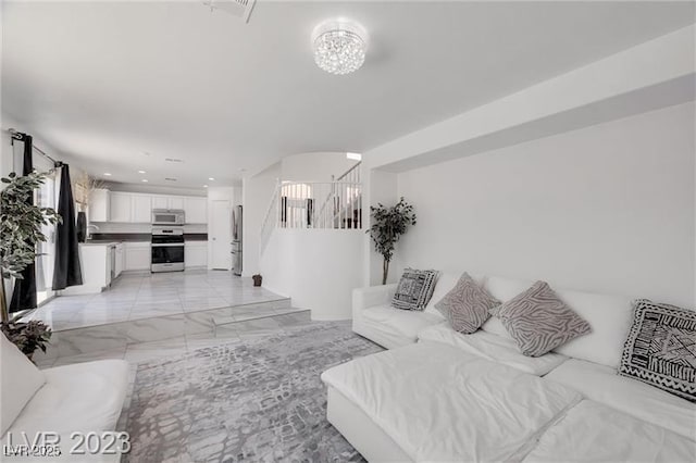 living room with an inviting chandelier