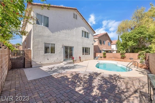 view of swimming pool with a patio