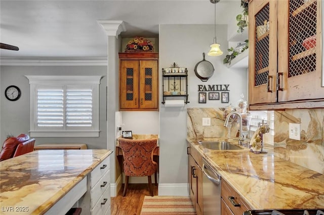 kitchen with sink, backsplash, hanging light fixtures, ornamental molding, and stainless steel dishwasher