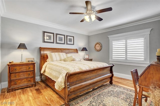 bedroom featuring ornamental molding, ceiling fan, and light wood-type flooring