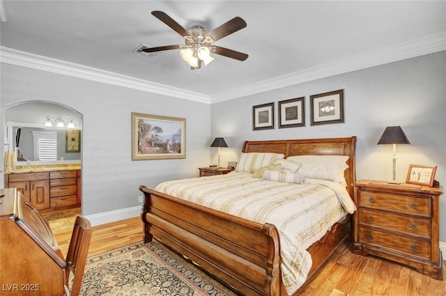 bedroom featuring crown molding, ensuite bathroom, ceiling fan, and light wood-type flooring