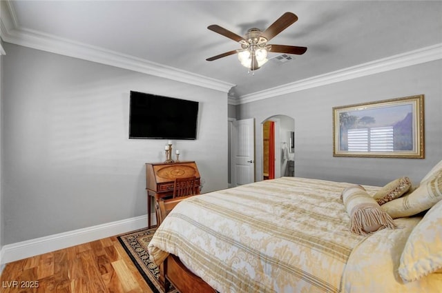 bedroom featuring ornamental molding, hardwood / wood-style floors, and ceiling fan