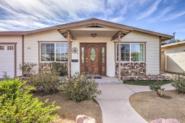 entrance to property featuring a garage