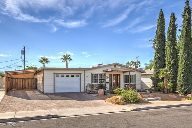 single story home with a carport and a garage