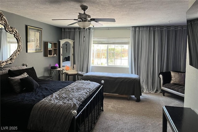 bedroom with carpet, a textured ceiling, and ceiling fan