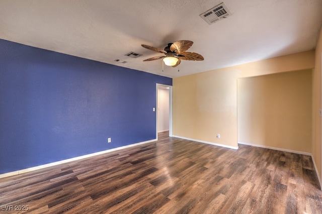 unfurnished room featuring ceiling fan and dark hardwood / wood-style flooring