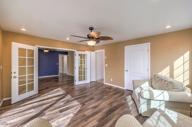 unfurnished living room with ceiling fan, dark hardwood / wood-style flooring, and french doors