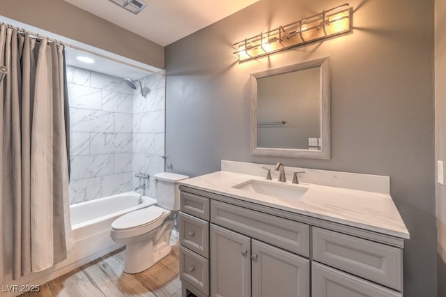 full bathroom with shower / bath combination with curtain, vanity, toilet, and wood-type flooring