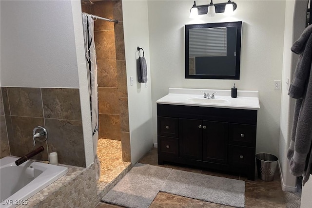 bathroom with vanity and separate shower and tub