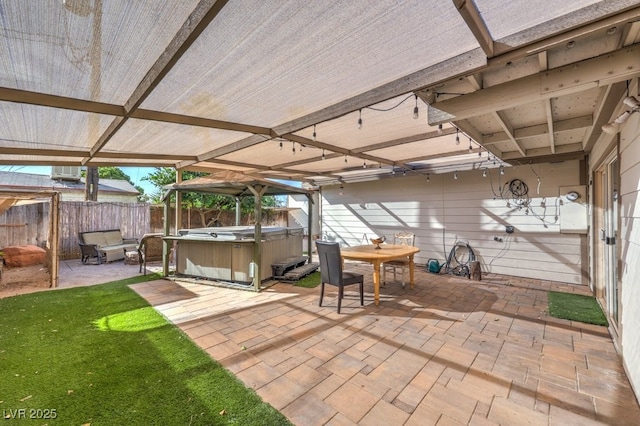 view of patio / terrace featuring a hot tub