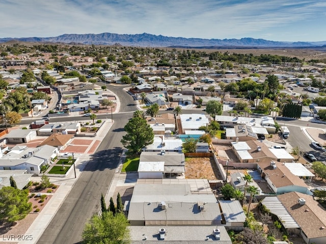 birds eye view of property featuring a mountain view