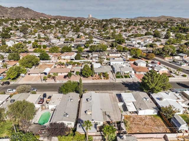 birds eye view of property with a mountain view