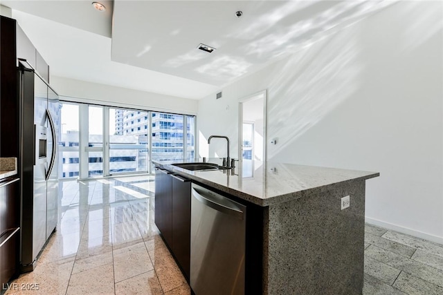 kitchen featuring sink, a kitchen island with sink, and stainless steel appliances