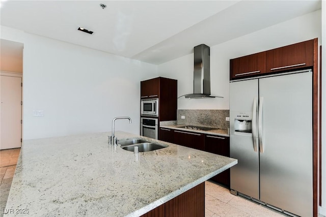 kitchen with a center island with sink, wall chimney range hood, sink, light stone counters, and stainless steel appliances