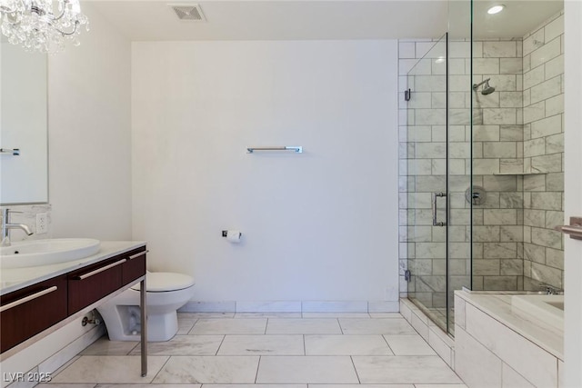 full bathroom with vanity, separate shower and tub, a chandelier, and toilet