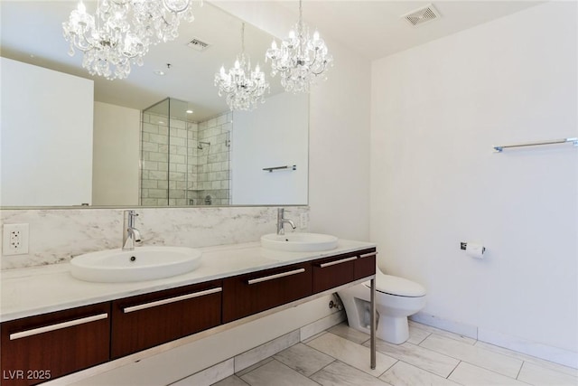 bathroom with walk in shower, toilet, vanity, and a notable chandelier