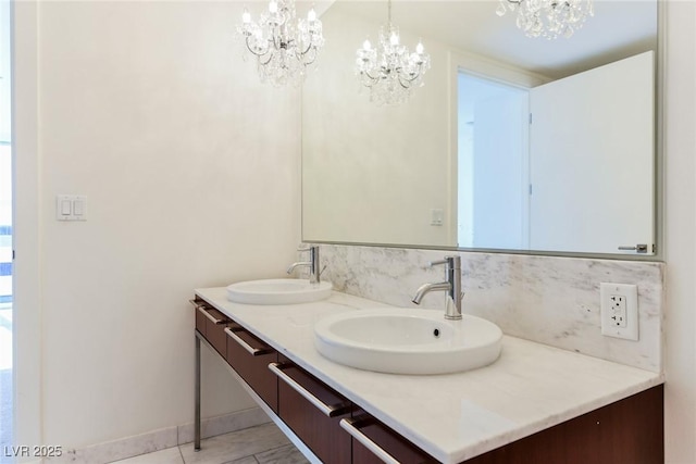 bathroom with vanity and a chandelier