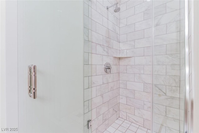 bathroom featuring a shower with door