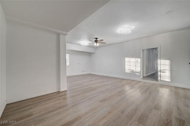 unfurnished room with ceiling fan and light hardwood / wood-style floors