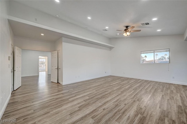 unfurnished room with ceiling fan and light hardwood / wood-style floors