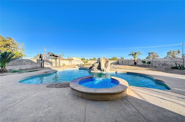 view of pool featuring a patio area, an in ground hot tub, and pool water feature