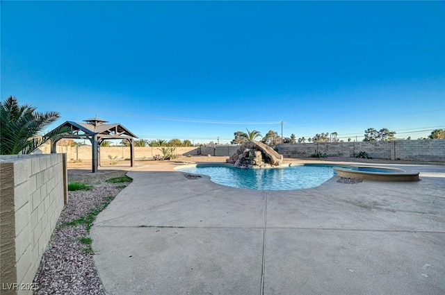 view of swimming pool featuring a gazebo, an in ground hot tub, a water slide, and a patio