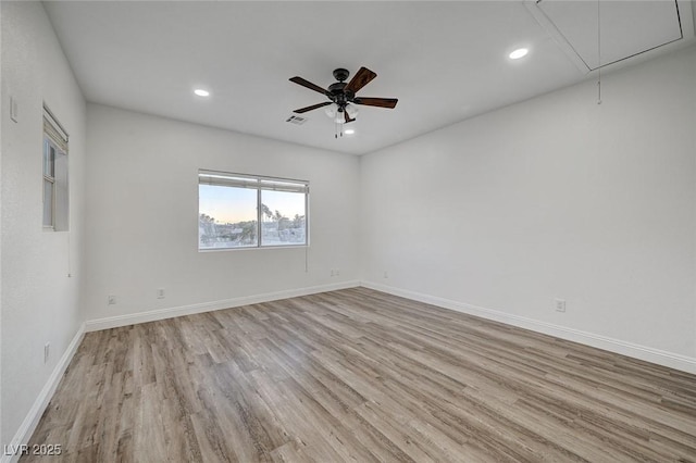 unfurnished room with ceiling fan and light hardwood / wood-style flooring