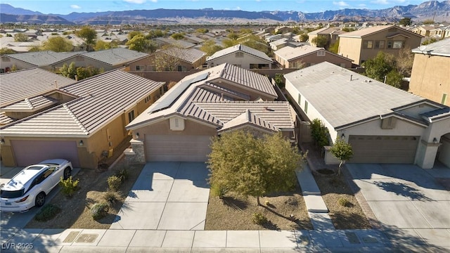 birds eye view of property featuring a mountain view