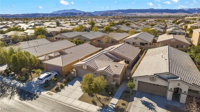 birds eye view of property with a mountain view