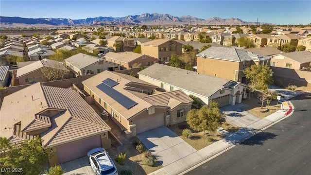 birds eye view of property featuring a mountain view