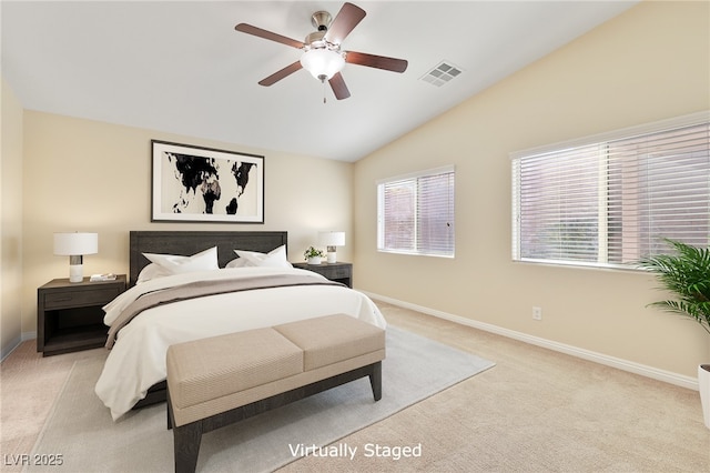 carpeted bedroom featuring lofted ceiling and ceiling fan