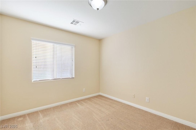 empty room featuring light colored carpet