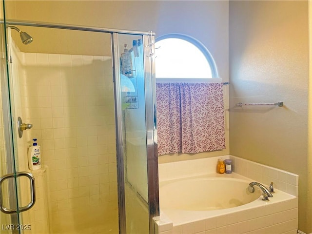 bathroom featuring plus walk in shower