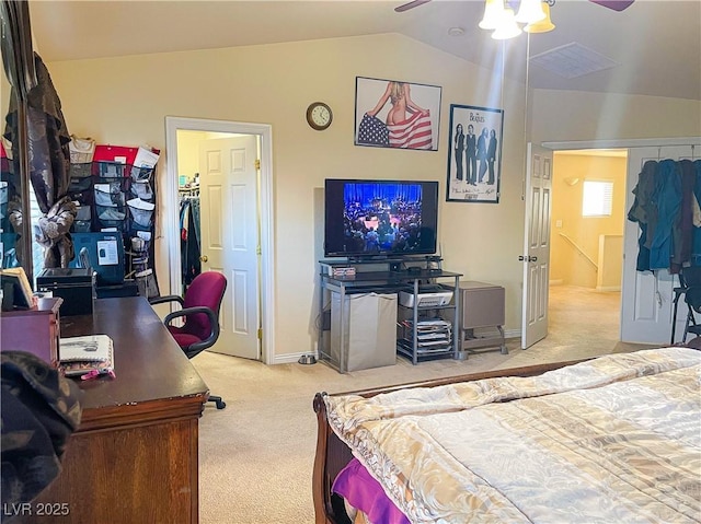 carpeted bedroom featuring lofted ceiling, ceiling fan, and a closet