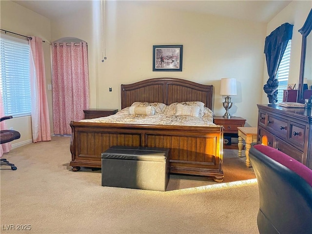 bedroom with light colored carpet