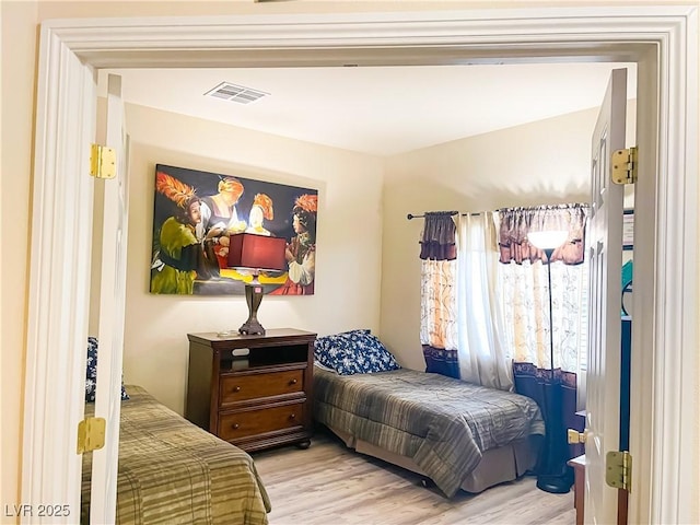 bedroom featuring light hardwood / wood-style flooring