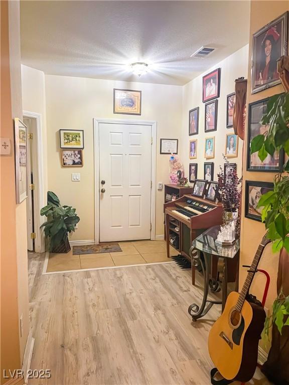 foyer with light wood-type flooring