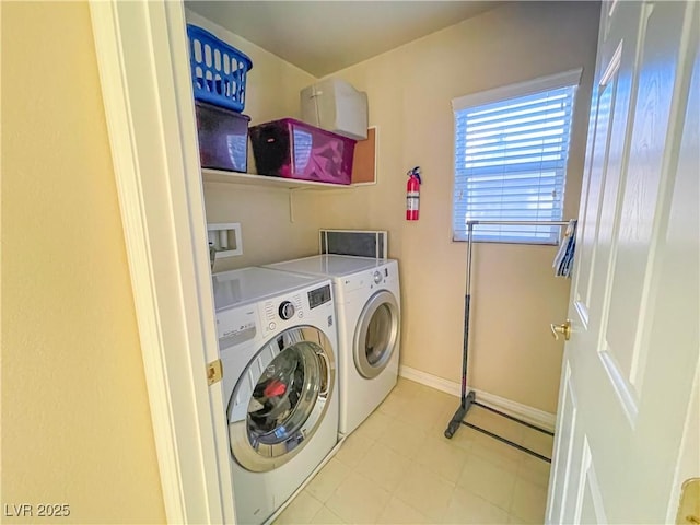 laundry area with independent washer and dryer