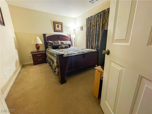 bedroom featuring light colored carpet