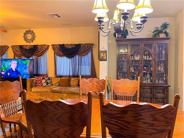 dining space with a notable chandelier