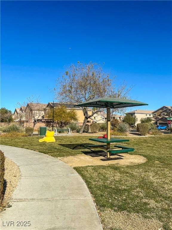 view of home's community with a lawn