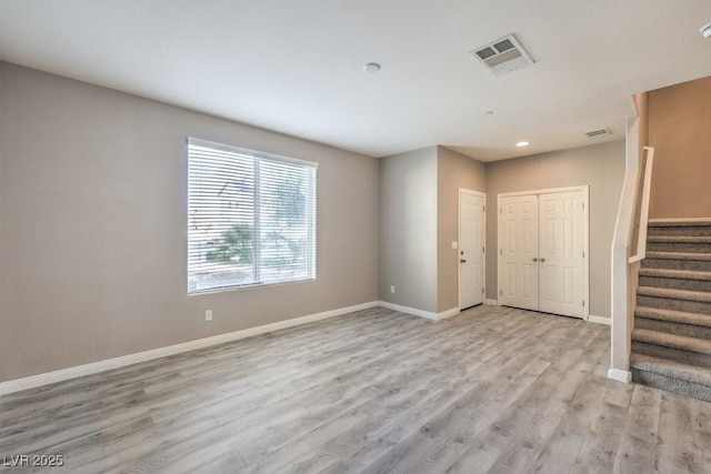 spare room with light hardwood / wood-style floors