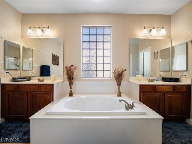 bathroom featuring vanity and a tub