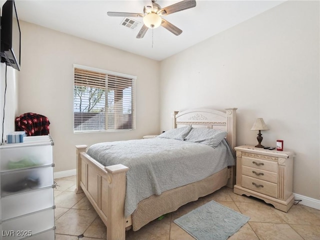 tiled bedroom with ceiling fan