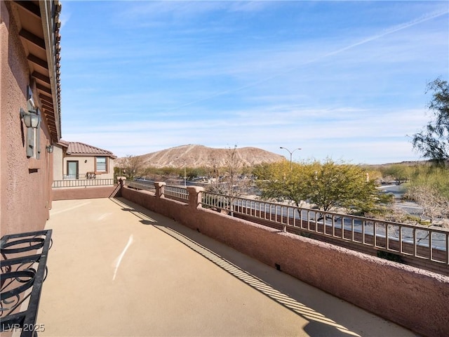 view of patio / terrace featuring a mountain view