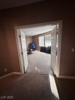 hallway with light colored carpet